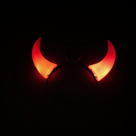 Illuminated headband-shaped devil horns, operate with red LEDs.